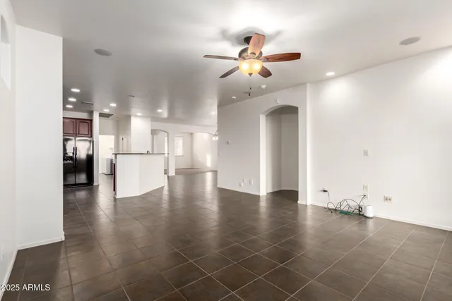 a kitchen with stainless steel appliances granite countertop a sink and a refrigerator