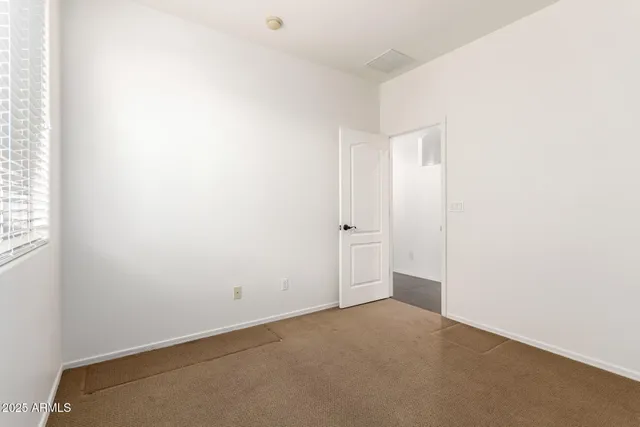 a bathroom with a window and a shower