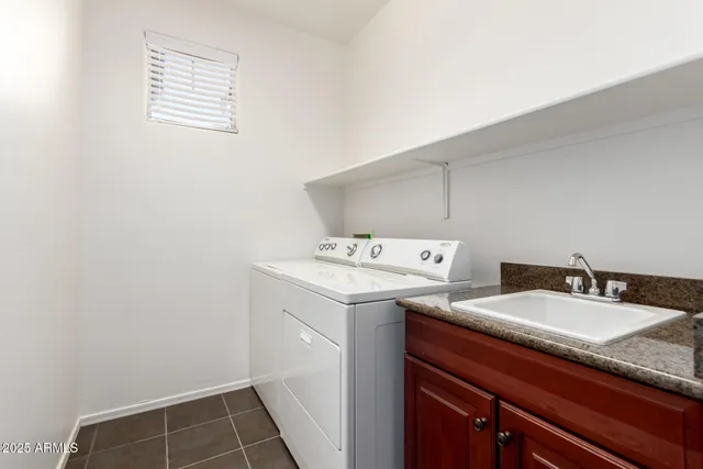 a view of empty room with projector and cabinets
