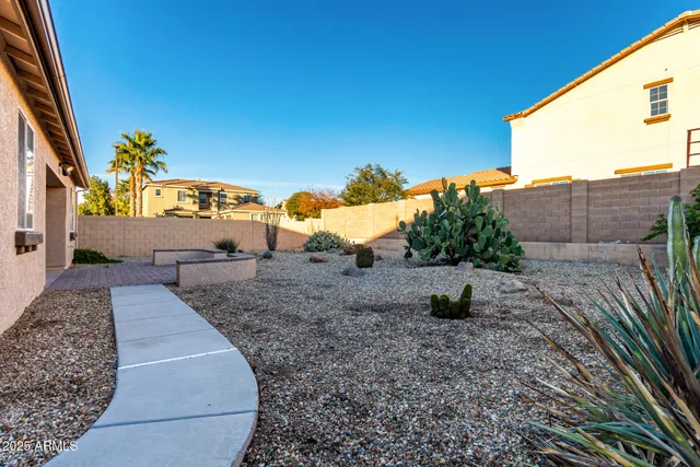 a view of a house with a backyard