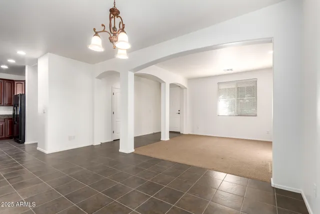 a view of a big room with closet and windows