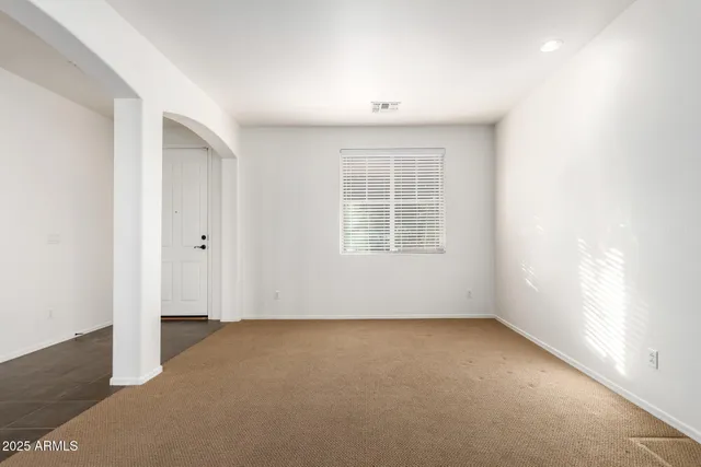 a view of an empty room with windows