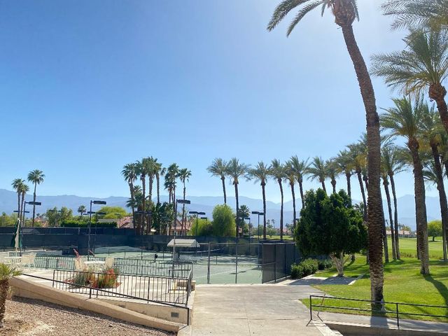 a view of a swimming pool and a yard