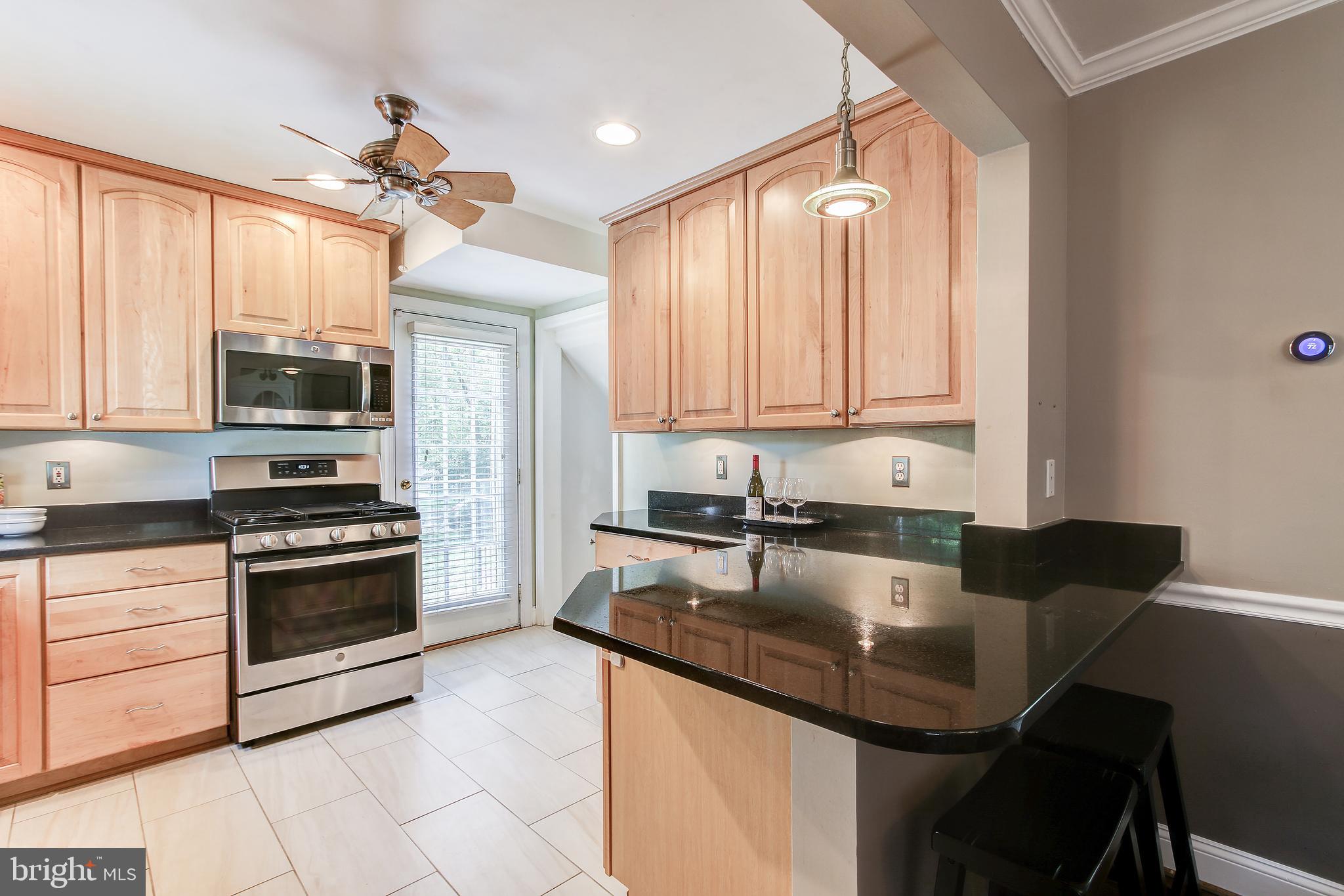 9200 Sudbury Road Silver Spring, MD 20901 - Photo 10 of 34 Granite countertops in kitchen