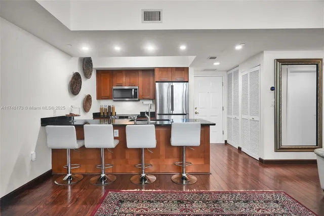 a view of kitchen with dining table and chairs