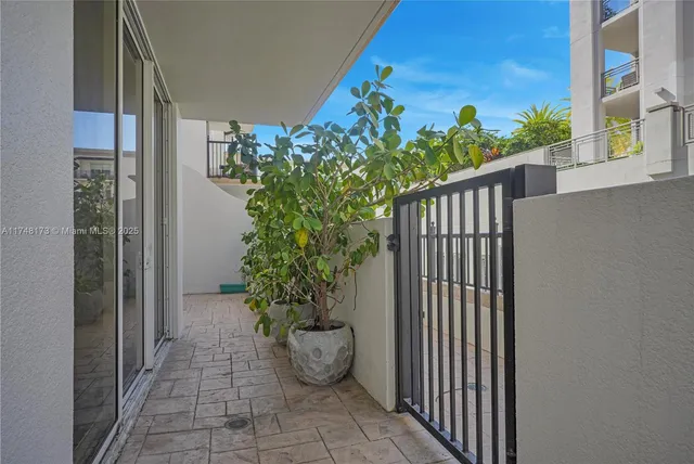 a view of a porch with potted plants