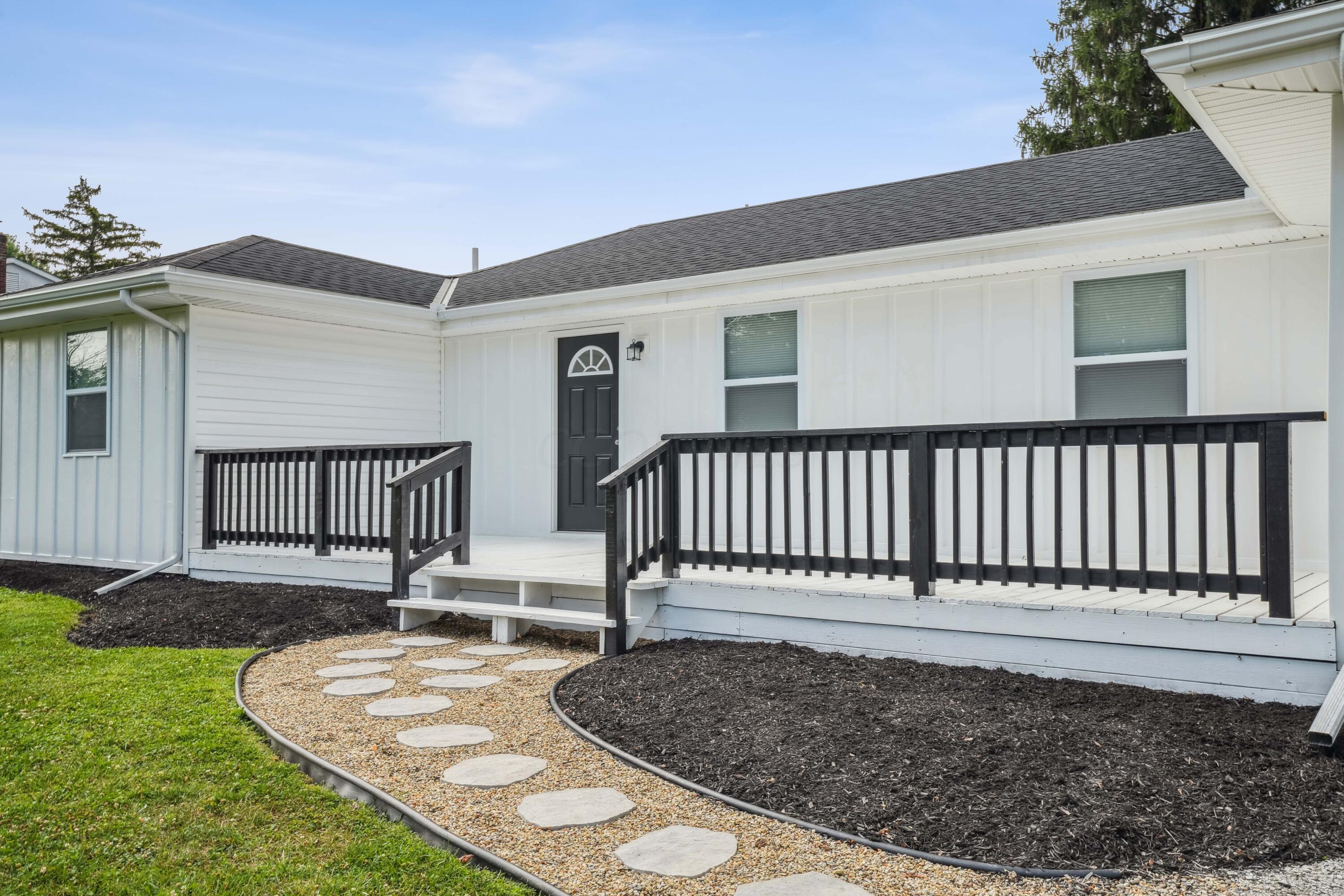6705 Johnson Road Galloway, OH 43119 - Photo 2 of 30 Huge front porch, perfect for front porch rocking chairs!