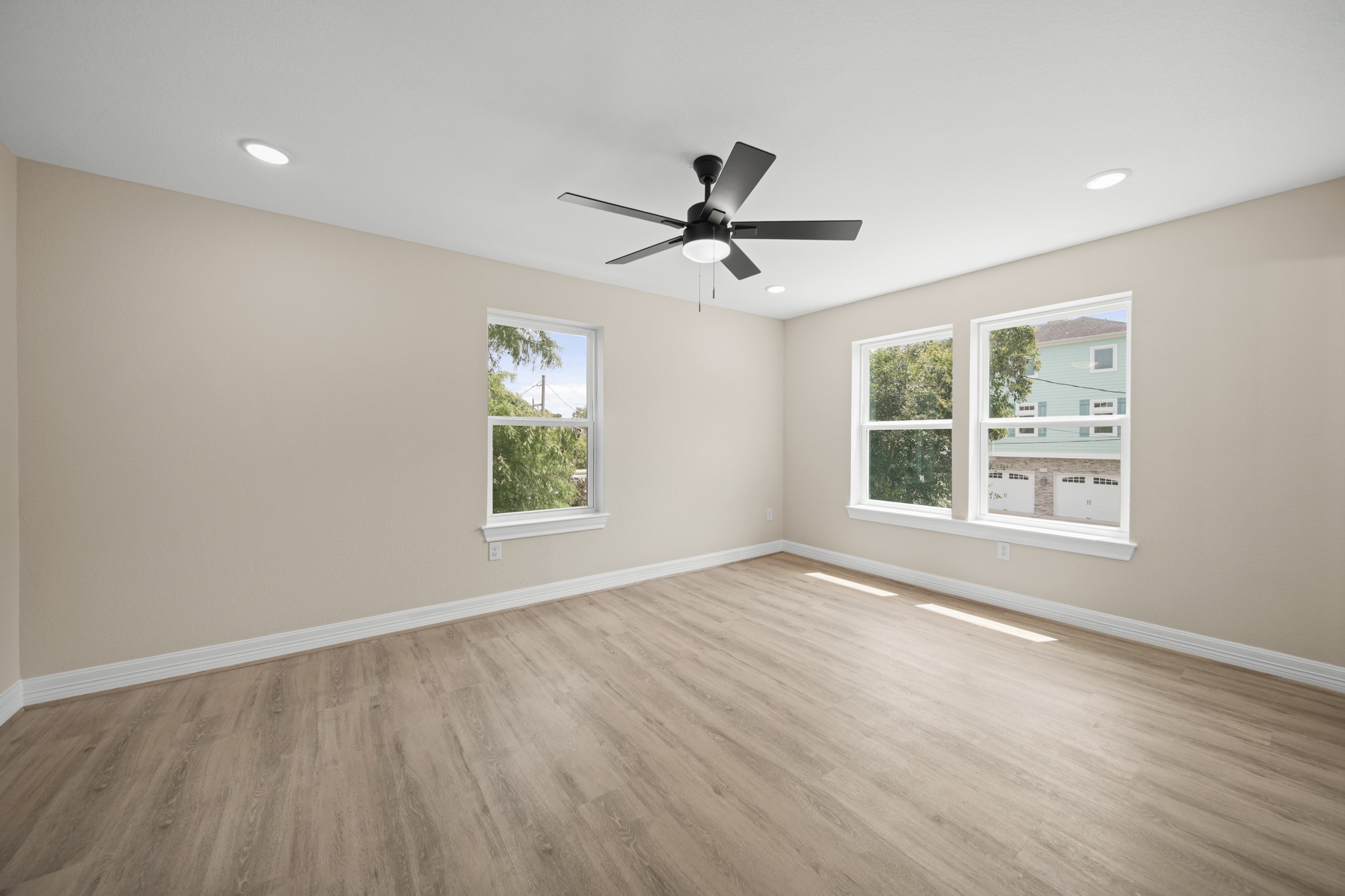 220 Pine Road Clear Lake Shores, TX 77565 - Photo 14 of 31 a view of empty room with wooden floor and fan