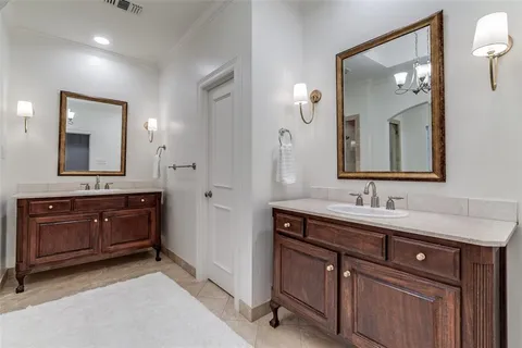 a bathroom with a sink vanity and mirror