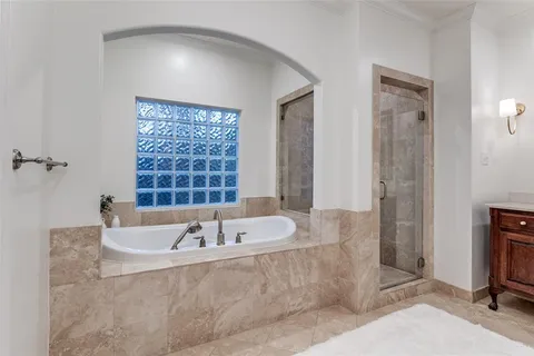 a bath tub sitting in a bathroom next to a window