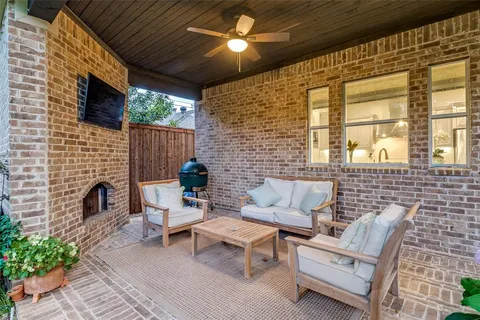 a outdoor living space with patio furniture and a fireplace