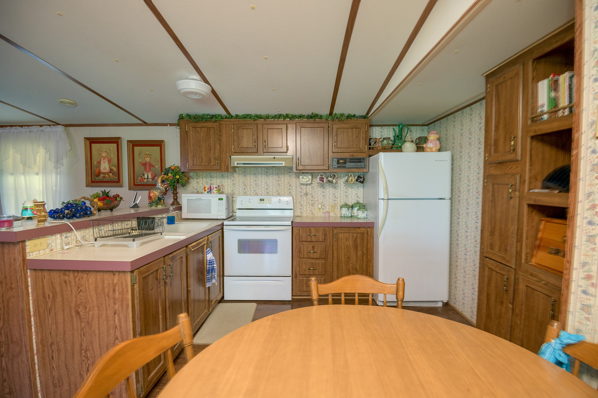 402 Oakley Hollow Road Alexandria, TN 37012 - Photo 14 of 29 a kitchen with a sink a stove a refrigerator and cabinets