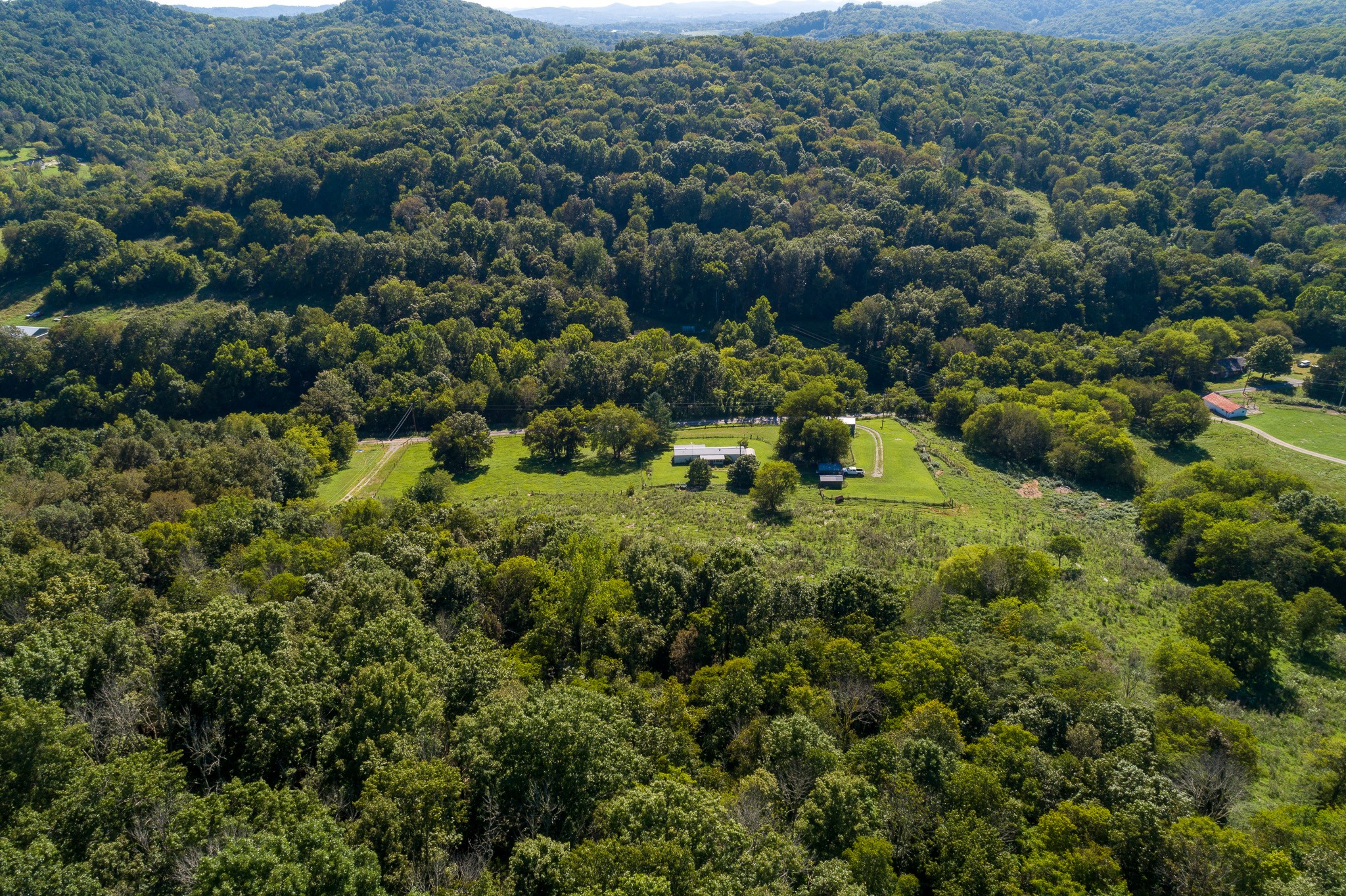 402 Oakley Hollow Road Alexandria, TN 37012 - Photo 3 of 29 an aerial view of residential house with outdoor space and trees all around