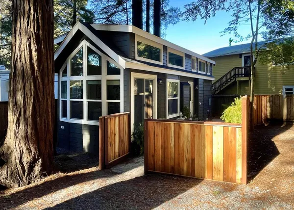 a view of a house with a door and balcony