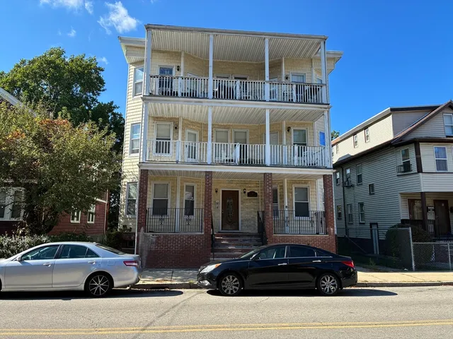 a car parked in front of a building