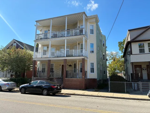 a car parked in front of a building