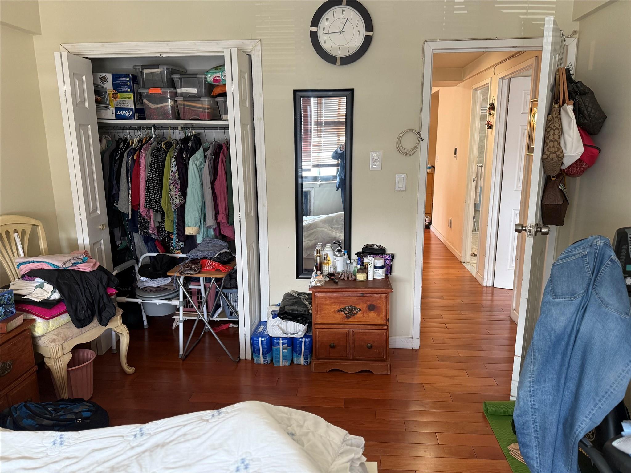 81-09 41st Avenue, Unit 5B Queens, NY 11373 - Photo 12 of 25 Bedroom featuring wood finished floors, a closet, and baseboards