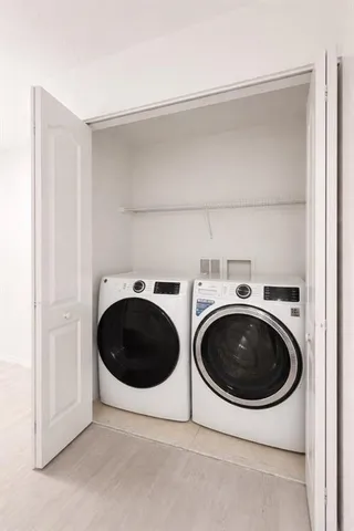 a utility room with dryer and washer