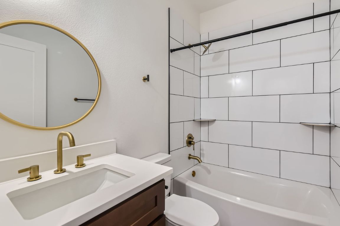 6820 Blue Dawn Trail, Unit 104 Austin, TX 78744 - Photo 5 of 9 Bathroom with bathing tub / shower combination and vanity