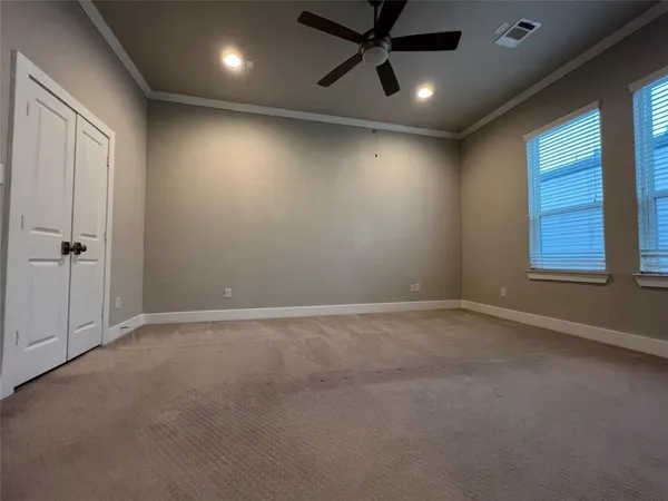 an empty room with a empty space and windows