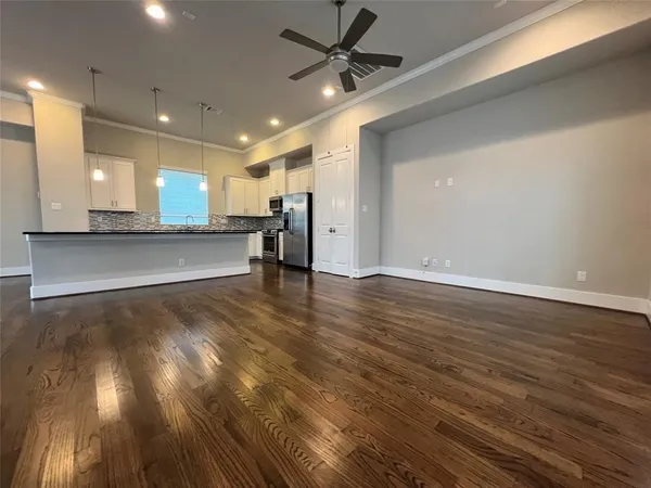 a kitchen with stainless steel appliances and wooden cabinets