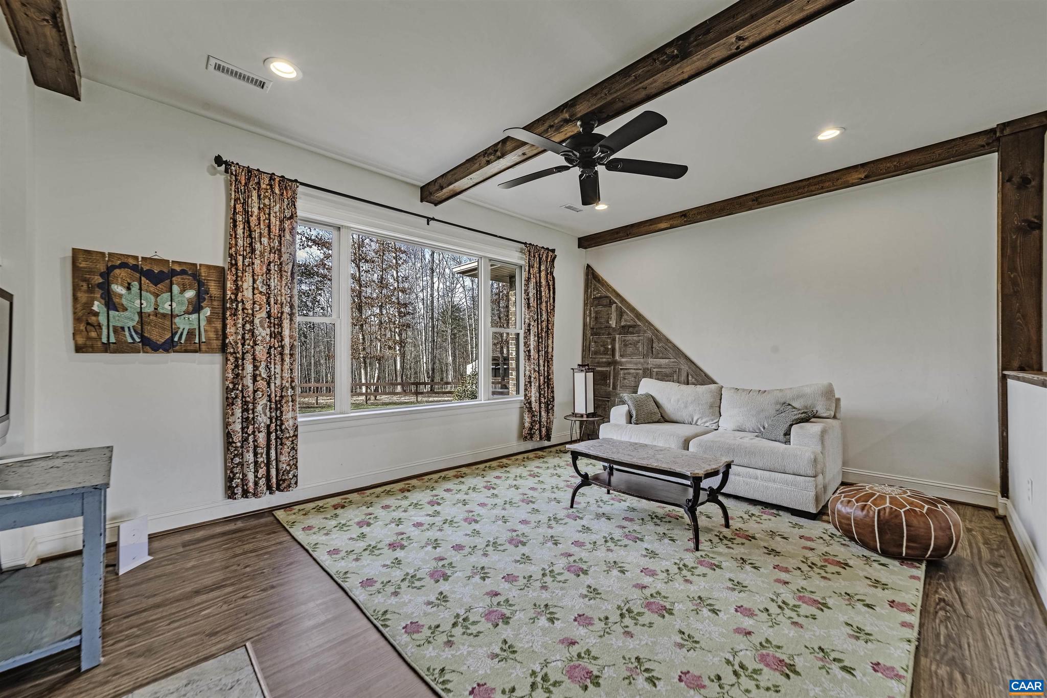 4337 Riddles Bridge Road Goochland, VA 23063 - Photo 12 of 43 a living room with furniture and a window