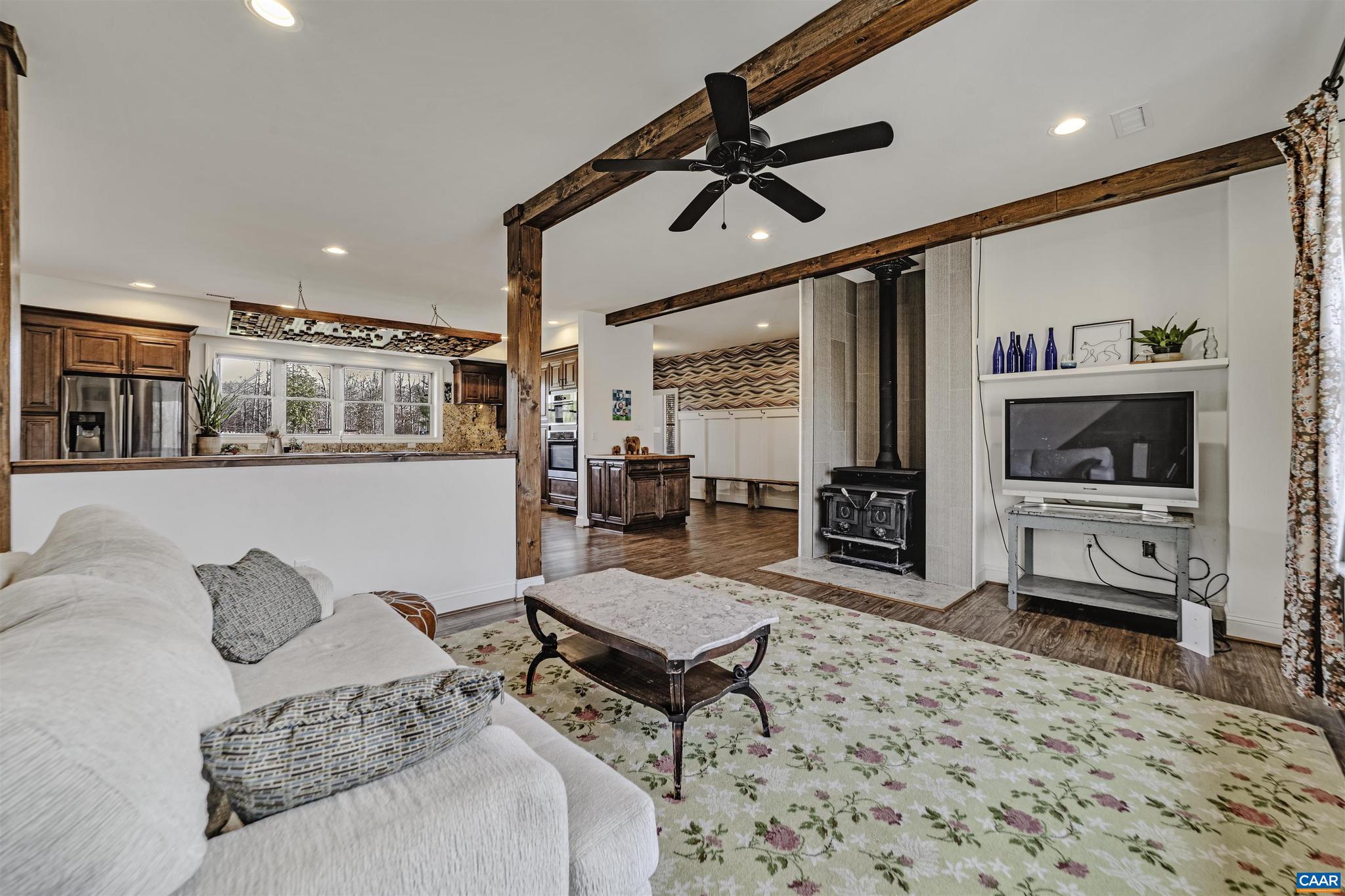4337 Riddles Bridge Road Goochland, VA 23063 - Photo 13 of 43 a living room with furniture and a flat screen tv