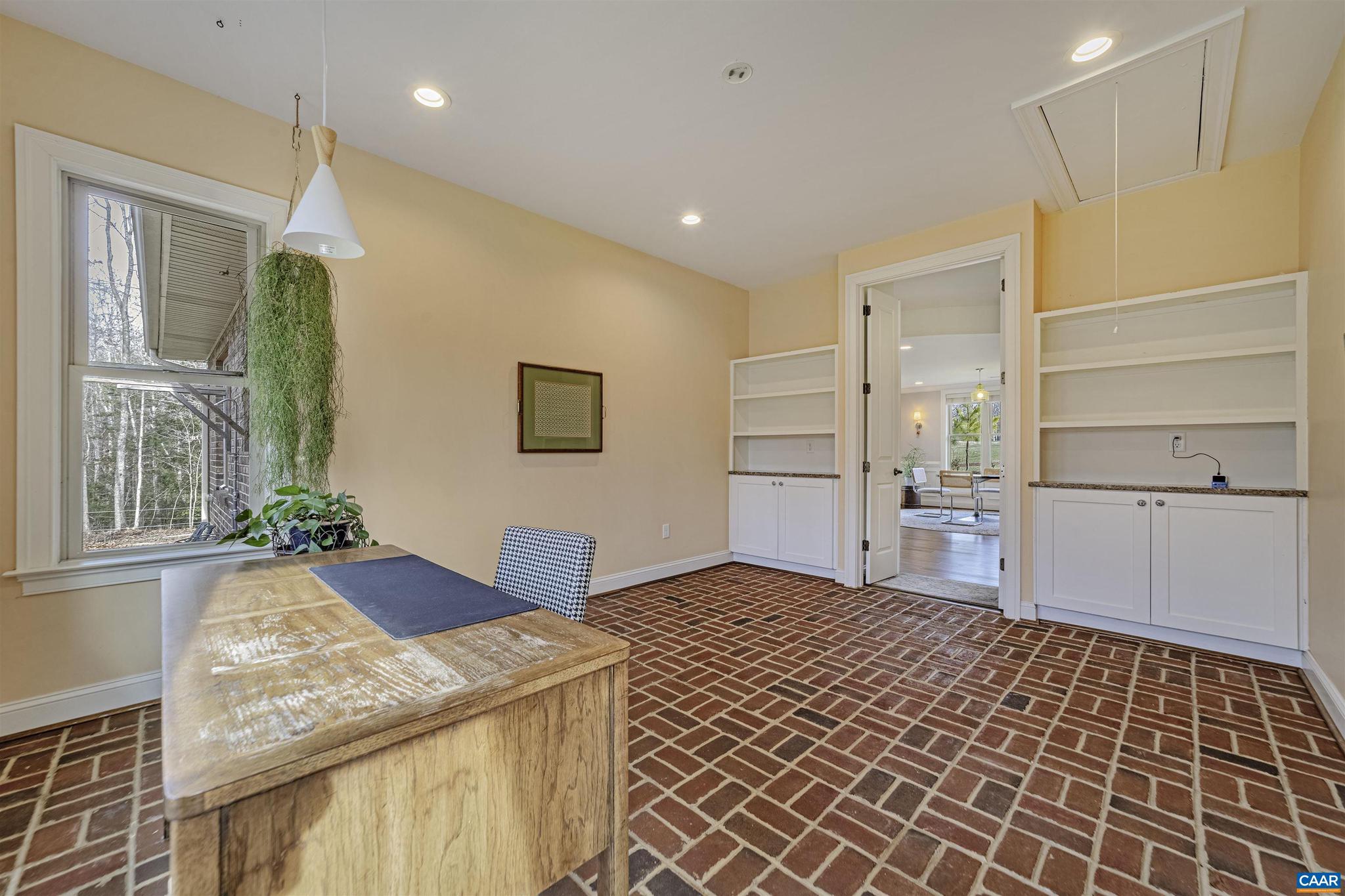 4337 Riddles Bridge Road Goochland, VA 23063 - Photo 16 of 43 a spacious bathroom with a granite countertop sink and a mirror