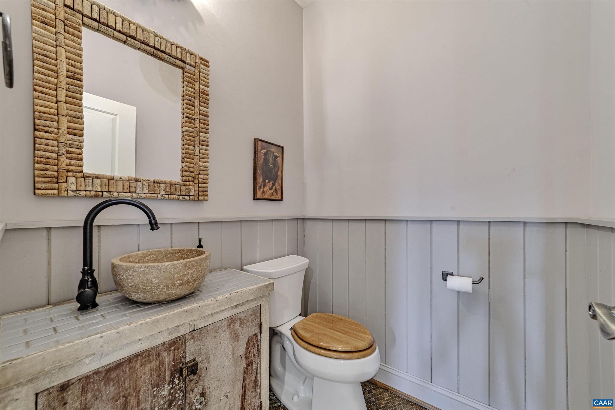 4337 Riddles Bridge Road Goochland, VA 23063 - Photo 21 of 43 a bathroom with a granite countertop toilet sink and mirror