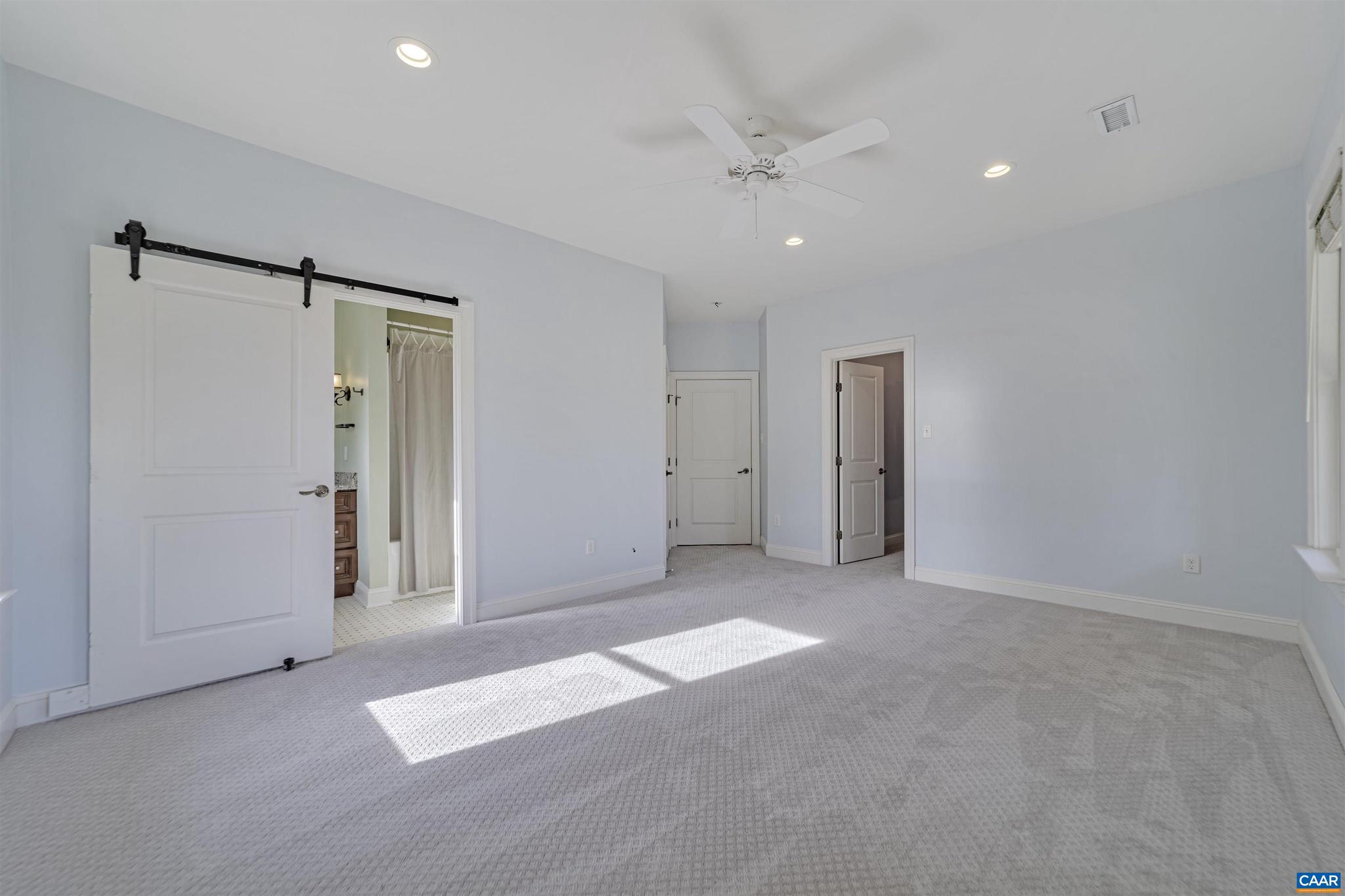 4337 Riddles Bridge Road Goochland, VA 23063 - Photo 27 of 43 an empty room with fan and entrance