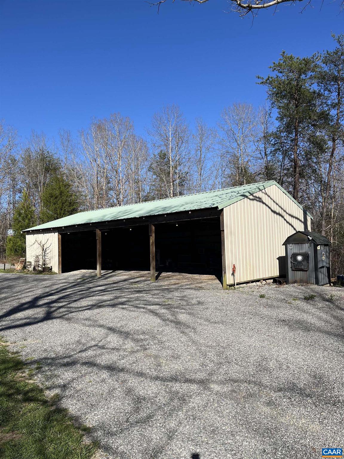 4337 Riddles Bridge Road Goochland, VA 23063 - Photo 39 of 43 a house with trees in the background