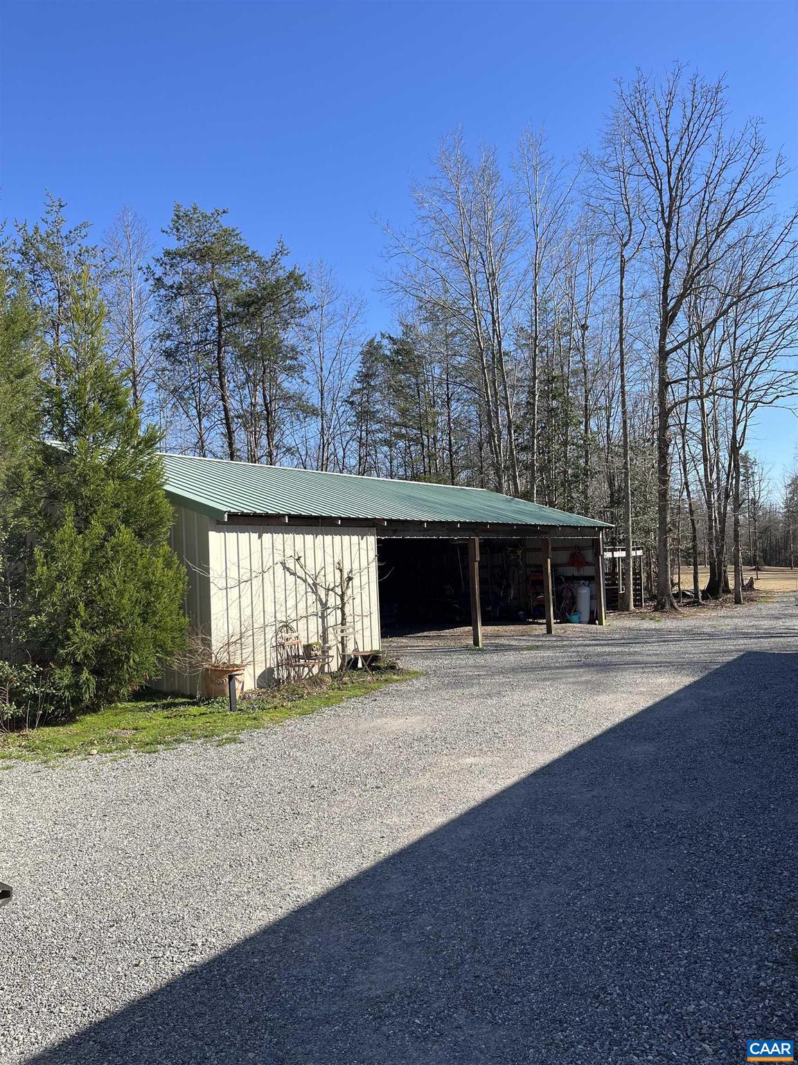 4337 Riddles Bridge Road Goochland, VA 23063 - Photo 42 of 43 a front view of a house with a yard and garage