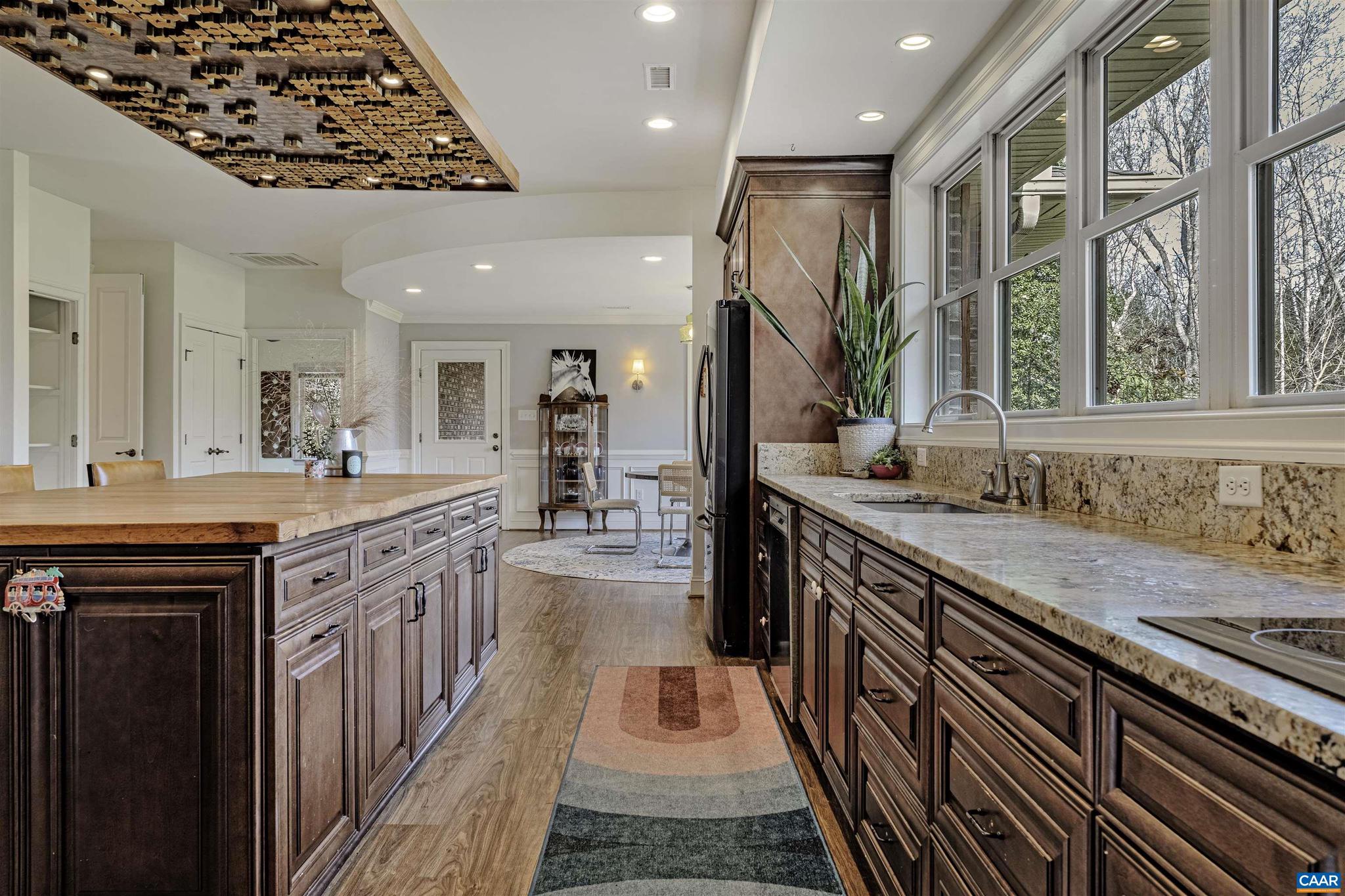 4337 Riddles Bridge Road Goochland, VA 23063 - Photo 7 of 43 a large kitchen with stainless steel appliances granite countertop lots of counter top space and wooden floor