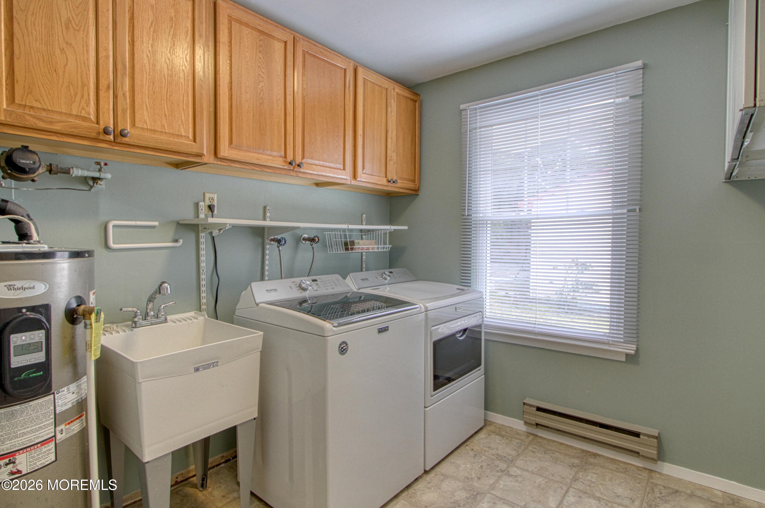 111 Sunset Road, Unit 60 Whiting, NJ 08759 - Photo 10 of 23 a utility room with sink dryer and washer