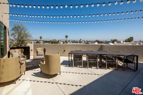 a view of a terrace with chairs