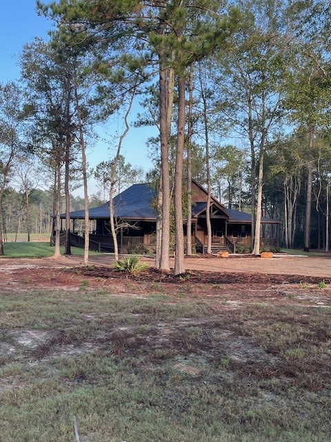 157 Rustic Ranch Drive New Waverly, TX 77358 - Photo 10 of 15 a front view of a house with a yard
