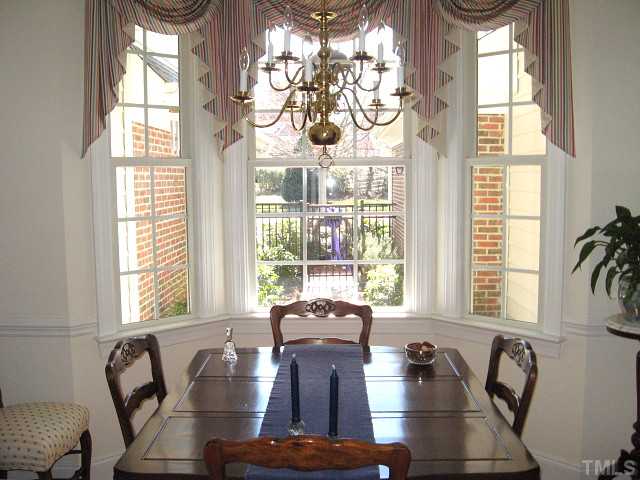 3426 Barron Berkeley Way Raleigh, NC 27612 - Photo 3 of 14 Lovely dining room with chair rail & bay window