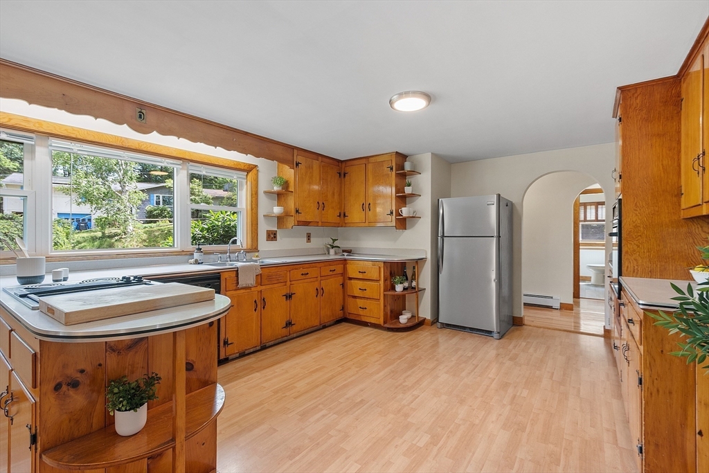35 Philip Road Athol, MA 01331 - Photo 11 of 37 a kitchen with sink a refrigerator and wooden cabinets
