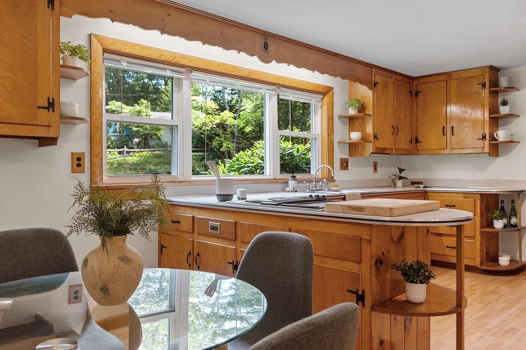 35 Philip Road Athol, MA 01331 - Photo 14 of 37 a kitchen with a table chairs sink and cabinets