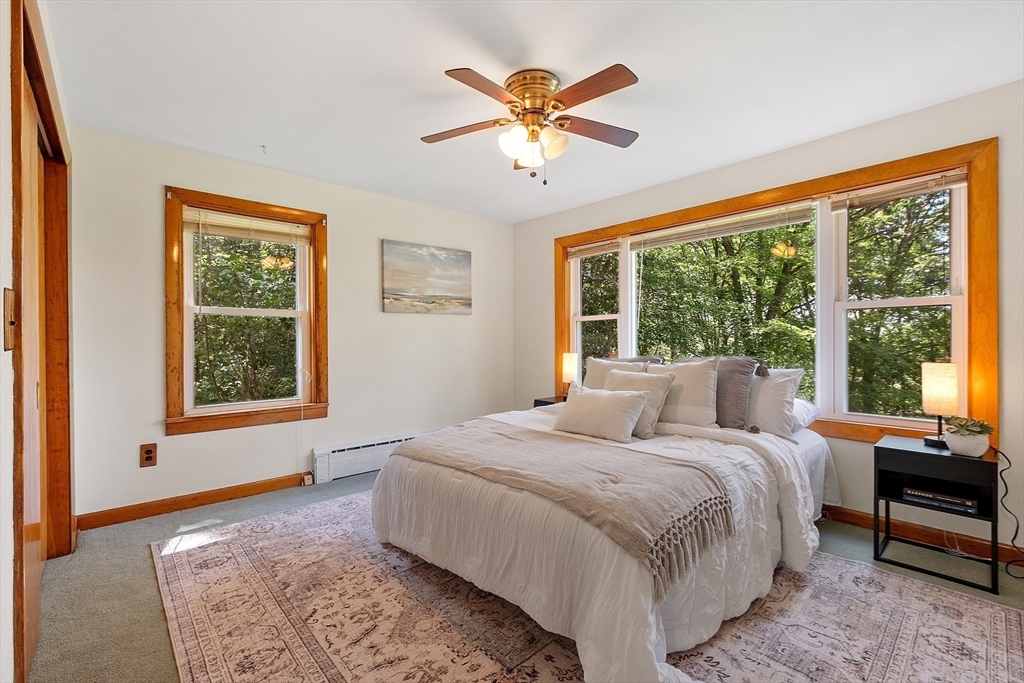 35 Philip Road Athol, MA 01331 - Photo 16 of 37 a bedroom with a large bed and a large window