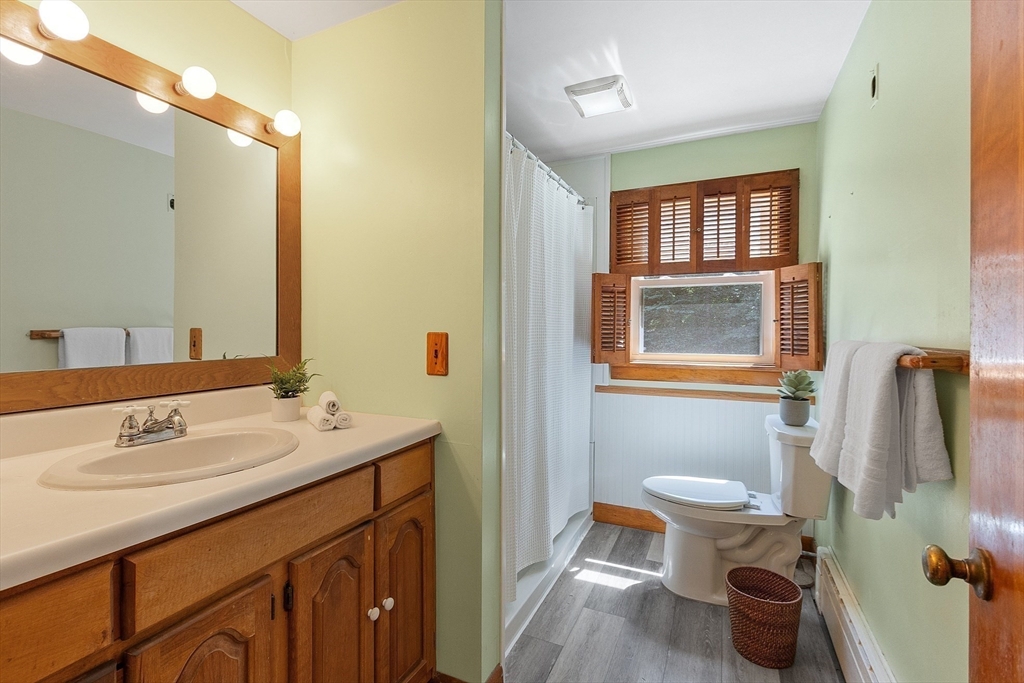 35 Philip Road Athol, MA 01331 - Photo 22 of 37 a bathroom with a toilet sink and mirror