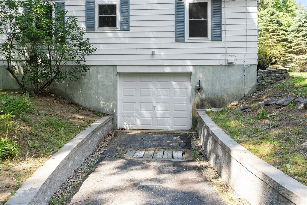 35 Philip Road Athol, MA 01331 - Photo 31 of 37 a front view of a house with a yard and garage