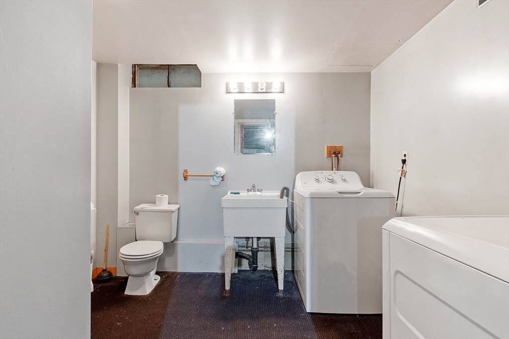 35 Philip Road Athol, MA 01331 - Photo 34 of 37 a bathroom with a toilet sink washing machine and mirror