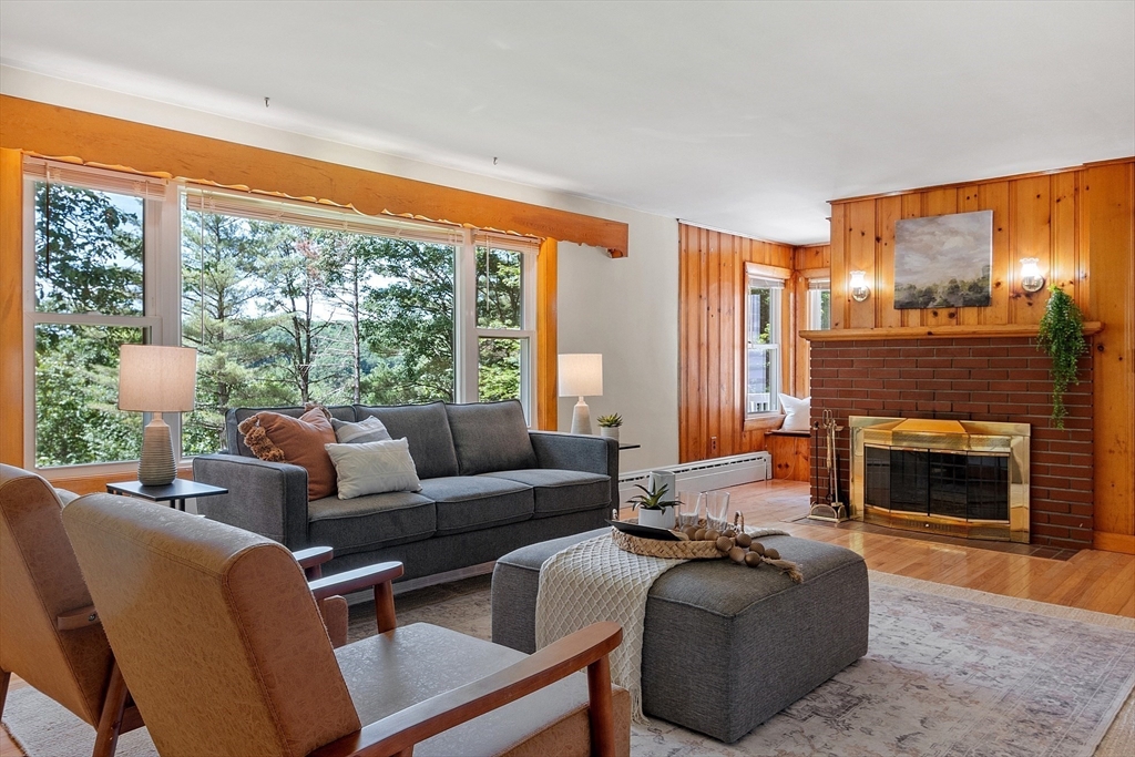 35 Philip Road Athol, MA 01331 - Photo 6 of 37 a living room with furniture large window and a fireplace