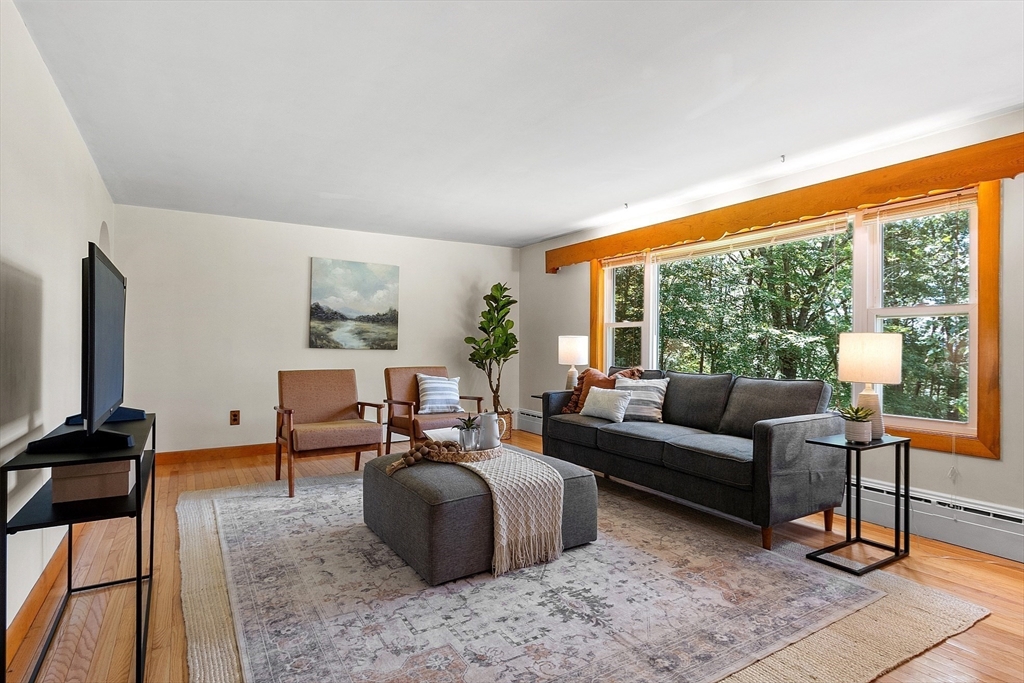35 Philip Road Athol, MA 01331 - Photo 8 of 37 a living room with furniture a rug a lamp and a large window
