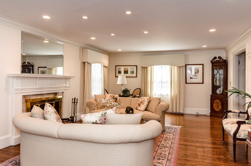55 Hallwood Road Brookline, MA 02467 - Photo 5 of 23 a living room with furniture and a fireplace