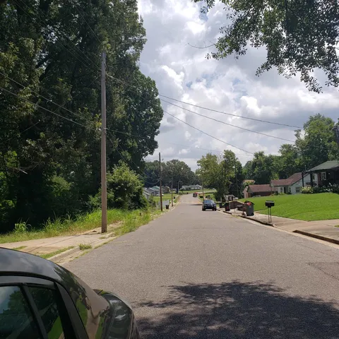 a view of a road with a yard