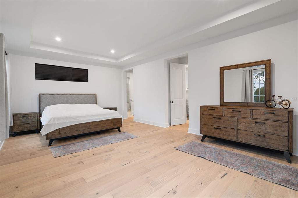 2331 Celebration Boulevard Celebration, FL 34747 - Photo 54 of 87 a bedroom with a bed and a dresser