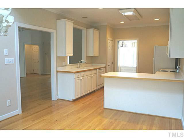 7624 Wilderness Road Raleigh, NC 27613 - Photo 14 of 25 View into the living room from the oversized opening. Notice the breakfast bar too. Breakfast Area