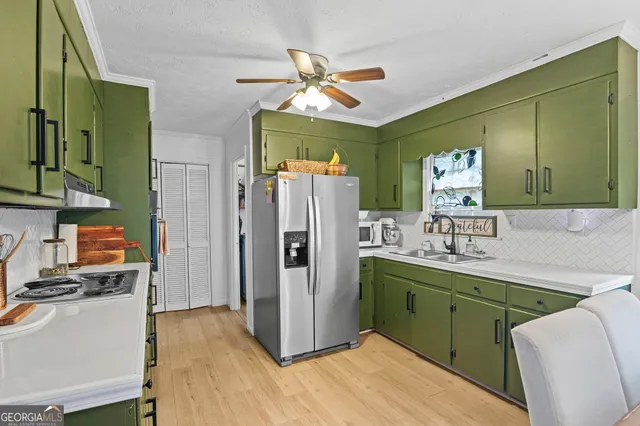a bedroom with a bed dresser and a book shelf